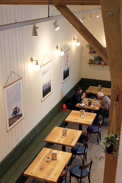 A view of the dining floor down from the deli’s mezzanine seating